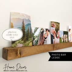 a wooden shelf with pictures on it