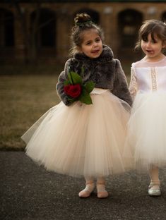 Flower Girl Fur Jacket This lavish faux fur bolero for little girls is deliciously soft and will make them look elegant for winter weddings or holiday black tie events. Faux Fur Bolero Details: ~A coat for the Luxury Winter Wedding Flower Girl Collection ~Ultra Soft Faux Fur (Brown) ~100% Silk Charmeuse Lining ~Long Sleeves ~Collar ~Hidden Hook & Eye Enclosures in Front (If you would like a different enclosure style (such as ribbons), please contact Mary Grace.) ~Handmade in America at Anagrassi Flower Girl Winter Wedding, Winter Flower Girl Dresses, Winter Wedding Flower Girl, Luxury Winter Wedding, Winter Flower Girl, Christmas Wedding Flowers, Faux Fur Bolero, Fur Bolero, Wedding Frocks