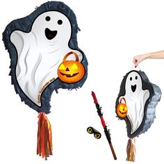 two halloween decorations that look like ghostes and pumpkins