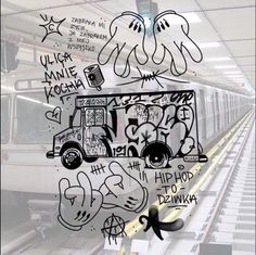 graffiti on the side of a train in a subway station, with an image of a van behind it