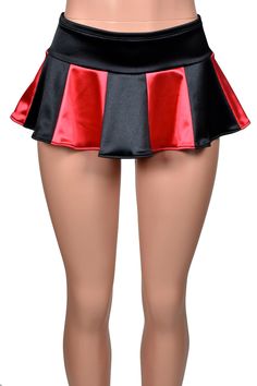 Mannequin wearing stretch satin micro mini skirt. Skirt has a 3 inch wide low rise waistband. Lower part of skirt is flared with a total of 12 panels. 6 panels are black, 6 panels are bright red. Flirty Stretch Mini Skirt, Fitted Satin Skort Mini Length, Fitted Satin Mini Skirt, Fitted Satin Mini Bottoms, Fitted Flirty Mini Bottoms, Flirty Fitted Mini Bottoms, Red Stretch Skirt For Costume Party, Black Fitted Satin Mini Skirt, Fitted Black Satin Mini Skirt