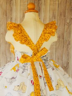 Winnie The Pooh Dress perfect for a birthday party or any occasion. Girls size 12-18 mo. 18- 24 mo. 2T 3T 4T 5T 6 7 8 I use an underskirt just to show how puffy is the dress. if you want a puffy look you will need to buy a under skirt and it sold separately. Please leave me a note with the following instructions. *Size Fitted Princess Dress With Ruffles For Garden Party, Cute Ruffled Princess Dress For Birthday, Cute Princess Dress With Ruffles For Birthday, Cute Fitted Princess Dress For Easter, Princess Style Easter Dresses With Ruffles, Cute Fitted Princess Dress For First Birthday, Easter Birthday Dress With Ruffles, Cute Ruffled Dress For Birthday, Fitted Dress For First Birthday Easter