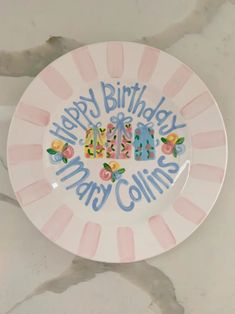 a plate with the words happy birthday mary collins on it