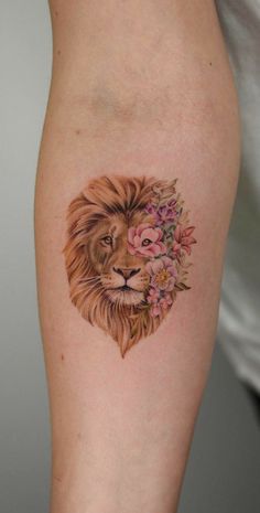 a lion with flowers in its mane on the arm