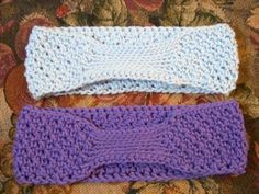 three crocheted headbands sitting on top of a couch