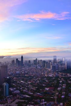 an aerial view of a city at sunset