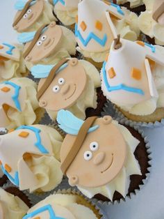 cupcakes with frosting and decorations made to look like cowboys