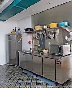 a kitchen with stainless steel appliances and blue ceiling