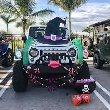 a jeep decorated for halloween parked in a parking lot