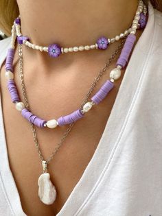 Three different boho summer necklaces with purple flowers, purple beads and freshwater pearls in different sizes and shapes. Combine them all together or wear them separetely as well. In Christina Christi Jewels store you can see more than 50 designs in Women's Necklaces. You can have them in 2-4 Days with DHL EXPRESS SHIPPING MATERIALS - Caoutchouc Beads. - Freshwater Pearls. - Stainless Steel Chain in Silver Color. - Metal Parts. - Adjustable Necklaces DIMENSIONS - Purple Flowers Necklace has Beach Jewelry With Colorful Purple Beads, Purple Jewelry With Colorful Beads For Beach, Summer Gift Purple Beaded Necklaces, Handmade Purple Beaded Necklace For Summer, Summer Purple Beaded Necklaces With Colorful Beads, Summer Purple Beaded Necklace With Colorful Beads, Handmade Purple Beaded Necklaces For Beach, Handmade Purple Necklaces For Beach, Handmade Purple Beach Necklaces