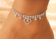 Perfect for the Bride to be, bridemaid gift, any other special day, or even a little bling at the beach, this Double Heart Rhinestone Anklet Bracelet offers an unexpected layer of timeless elegance. Measures 9 inches in length with a lobster claw clasp. Silver Heart Anklets For Party, Silver Anklets For Valentine's Day Party, Elegant Heart-shaped Anklets For Party, Elegant Heart-shaped Party Anklets, Elegant Valentine's Day Party Anklets, Elegant Heart-shaped Anklets For Wedding, Elegant Wedding Anklets For Valentine's Day, Elegant Wedding Anklets, Rhinestone Anklet