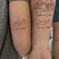 two people with matching tattoos on their arms, both showing names and date tattoo designs