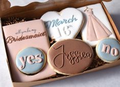 decorated cookies in a box with congratulations messages