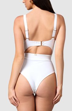 Inspired by vintage 60’s swimsuits, this ultra-flattering monokini is perfect for the classic beauty. The thick elastic in the waistband gives maximum tummy control for that classic hourglass figure. Adjustable straps – Shoulder and back clamp adjust for a more tailored fit Removable padding – To choose what fits you best Thick elastic waistband – Cinches in the waist Big bust and small bust friendly Cheeky bottoms – Most flattering cut to accentuate your bottom White High-waist Swimwear With Built-in Bra, White Bodysuit With Built-in Bra For Pool, White High Waist Lined Swimwear, White Beachwear Swimwear With Moderate Back Coverage, White Underwire Bodysuit For Swimming, White Underwire Bodysuit For Poolside, White Underwire Bodysuit For The Pool, White High Waist Swimwear With Built-in Bra, Swimming Wear