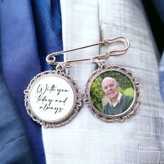 an old man wearing a blue suit and white shirt with his name on the badge