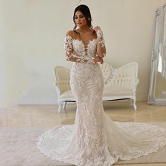 a woman in a wedding dress is posing for the camera with her hands on her hips