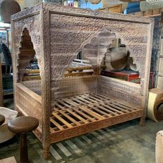 a bed made out of wood in a room