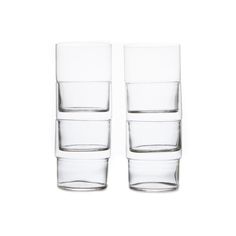 two clear glasses sitting next to each other