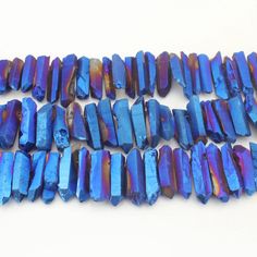 several pieces of blue and purple glass beads