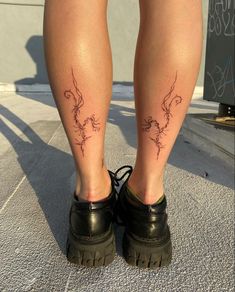 the legs of a person with tattoos on them