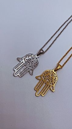 Introducing "The Miriam" our beautiful Hamsa hand/ Hand of Fatima/ Hand of Miriam pendant necklace. Traditional to the Middle East and North Africa,  this beautiful ancient symbol has origins in Islam, Judaism and Christianity. It is a symbol of protection, warding off evil and keeping you safe.  Downward Facing: this symbolises abundance and prosperity, inviting good things to come into your life. Upside down Hamsa hand is also seen as a blessing for fertility and as a means for receiving answe Symbolic Pendant Necklace With Intricate Design, Symbolic Necklaces With Intricate Design, Symbolic Intricate Design Necklace For Gift, Symbolic Etched Jewelry For Blessing, Spiritual Etched Metal Necklace, Etched Pendant Necklace For Blessing, Necklace Traditional, Symbole Protection, Fatima Hand