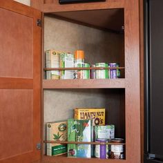 an open cabinet with food items in it