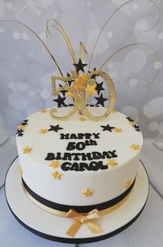 a 50th birthday cake decorated with stars and ribbons