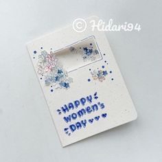 a happy women's day card with flowers and hearts on the front is shown