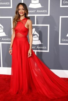 a woman in a red dress on the red carpet