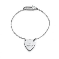 From Gucci, this sterling silver bracelet from the Trademark Collection will allow you to lend a luxe look to your daily style. This chain bracelet boasts a heart shaped charm stamped with the Gucci logo. This bracelet measures 6 2/3 inches in length. Made in Italy. Style #: YBA223513001017 Gucci Jewellery, Gucci Bracelet, Bracelet With Heart, Sterling Silver Heart Pendant, Gucci Jewelry, Gems Bracelet, Platinum Jewelry, Silver Charm Bracelet, Bracelet Silver