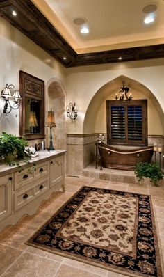 a large bathroom with two sinks and a bathtub in the middle of the room