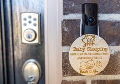 there is a baby sleeping sign on the door