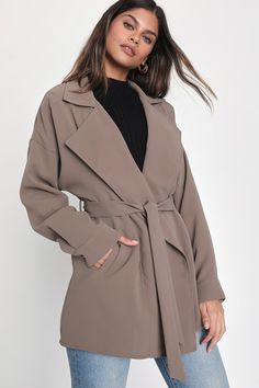 We can't wait to layer the Lulus Wondrous Season Taupe Short Belted Trench Coat over all our favorite cozy ensembles! Lightweight woven fabric shapes this chic trench coat that has a collared neckline with notched lapels and long sleeves with drop shoulders and button cuffs. The thigh-length silhouette features diagonal front pockets and a tying sash at the waist. Style this coat over your favorite sweater for those lightly breezy days! Fit: This garment fits true to size. Length: Size medium me Short Trench Coat, Trench Coat Outfit, Linen Fashion, Lulu Fashion, Outfit Formulas, Belted Trench Coat, Stylish Jackets, Favorite Sweater, Coat Outfits