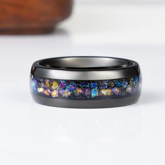 Our ring has been inspired by stunning Orion nebula and the beautiful and unique color patterns found in outer space. All stones have been set to mimic the starry skies where the Orion Nebula can be found. A truly unique wedding band for both the bride and groom.✦ DETAILS ✦✧ Material: Tungsten Carbide and Crushed Black Opal, Blue Opal, Sandstone, Fire Opal Inlay✧ Band Width: 8mm✧ Your inlay is protected with a coating that defends it from water, dirt, and grime. Alexandrite Necklace, Groom Details, Pave Heart Necklace, Rutilated Quartz Necklace, Black Gold Ring, Orion Nebula, Black Wedding Band, Sterling Silver Rings Set, Sapphire Band