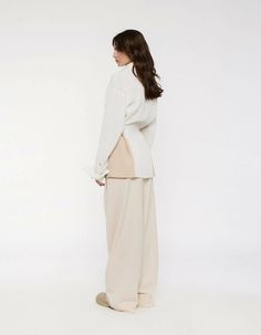 At the intersection of everyday and occasionwear, the RYE trousers find a smart-casual balance that makes this transseasonal piece the champion of versatility. The fluid drape emphasizes the long, wide-leg silhouette while the lowrise fit adds a cool, laidback vibe. Detailed with pleats, the RYE trousers offer a classic sleek look. The model is 178 cm and wears a size S.Composition: 15% RAY, 80% PES, 5% SP Machine wash at 40°. Iron on medium. Do not bleach. Do not tumble dry. Please be aware tha Rye, Knit Tees, Sleek Look, Tumble Dryer, Smart Casual, Occasion Wear, Wide Leg, Trousers, How To Wear