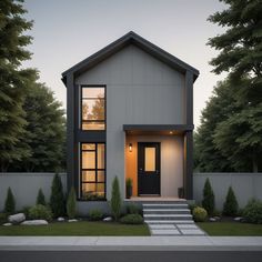 a modern house is shown at dusk with the front door and steps leading up to it