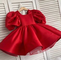 Satin Frock for kids  Lining - Soft fabric lining  Type - Skater skirt  Sleeves - Puff Satin Frocks For Kids, Red Baby Dress, Frocks For Kids, Girl Red Dress, Kids Frocks Design, Kids Dress Patterns, Kids Dress Wear, Baby Dress Design