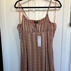 Mini Dress Strap Dress - Women's L; With Tags Never Worn. Summer Vacation Plaid Midi Dress, Plaid Sundress Mini Dress For Vacation, Plaid Sundress Midi Dress For Summer, Sleeveless Plaid Midi Dress For Summer, Vacation Sleeveless Plaid Mini Dress, Plaid Sleeveless Mini Dress For Vacation, Plaid Midi Dress For Summer Daywear, Plaid Daywear Dresses For Summer, Urban Outfitters Summer Dress With Spaghetti Straps