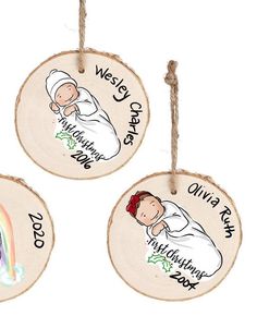 three wooden ornaments with baby's names on them