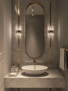 a white sink sitting under a bathroom mirror next to a wall mounted faucet