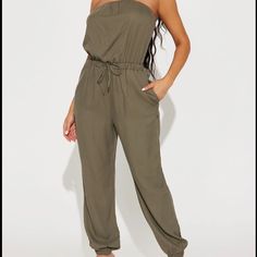 Olive Green Fashionnova Jumpsuit Size Medium Nwt Never Worn!! Casual Solid Strapless Jumpsuit For Night Out, Fitted Casual Strapless Jumpsuit For Loungewear, Casual Strapless Jumpsuit For Spring Loungewear, Casual Strapless Jumpsuit For Day Out, Casual Strapless Jumpsuit For Summer Loungewear, Black Denim Jumpsuit, Crochet Jumpsuits, Velour Jumpsuit, Fashion Nova Jumpsuit