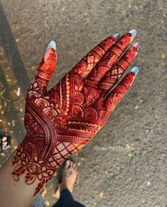 a person's hand with henna on it