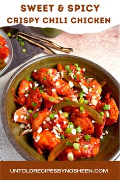 sweet and spicy crispy chilli chicken in a bowl with green onions on the side