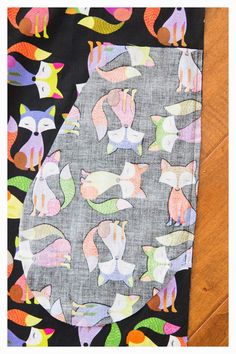 an image of a piece of fabric with different animals on it and the bottom half