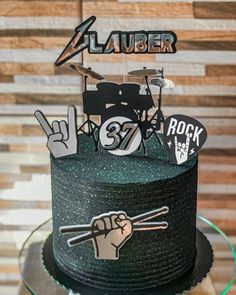 a birthday cake decorated with musical instruments and symbols