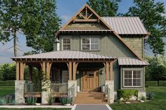 a small green house with a porch and front door