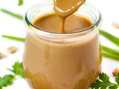 a jar filled with peanut butter and topped with a spoon