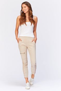 This stretch poplin pant features jersey side inserts for an impeccable fit, a jersey elastic pull-on waistband, two front pocket, one side zip pocket, and ruching on leg front. Stretch poplin - 98/2 Cotton/Spandex Jersey - 92/8 Cotton/Spandex Color description: Classic khaki XS-XL Front rise: ~9.5" Back rise: ~14.5" Inseam: 28" 1X-3X Front rise: ~10.5" Back rise: ~19.5" Inseam: 27" Preshrunk Machine washable Imported MODELS Megan is wearing size X-Small Height: 5'10" | Bust: 34B | Waist: 25" | Stretch Cotton Pants With Elastic Side Panels, Stretch Cotton Ruched Bottoms, Casual Stretch Pants With Ruched Sides, Chic Stretch Ruched Pants, Stretch Cotton Bottoms With Ruched Detail, Chic Stretch Cargo Pants With Elastic Waistband, Stretch Cargo Pants With Pull-on Style, Stretch Pull-on Style Cargo Pants, Comfortable Cotton Moisture-wicking Joggers