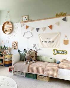 a child's bedroom decorated in white and green