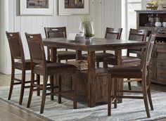 a dining room table with chairs around it